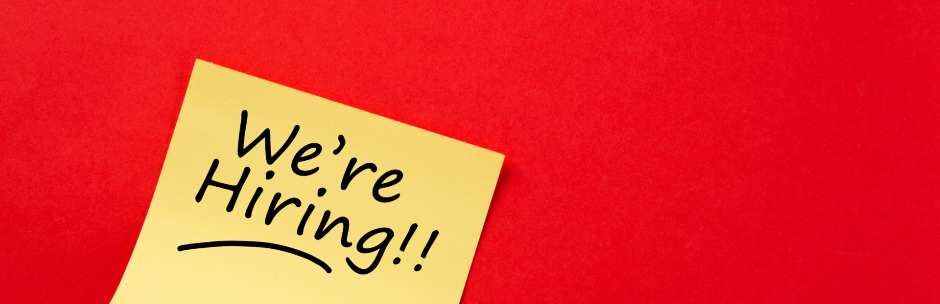 note with words saying "we're hiring"