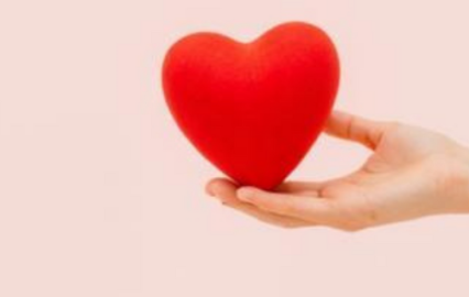 hand holding red heart