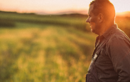 Farmer walking in field