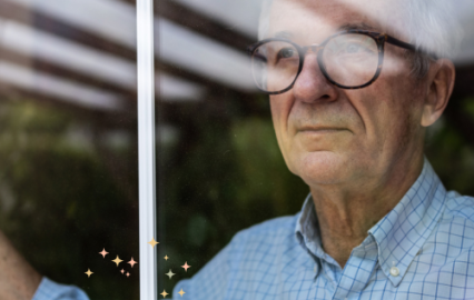 man looking out window