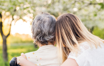 woman supporting older woman