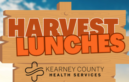 harvest lunches logo on sign in field
