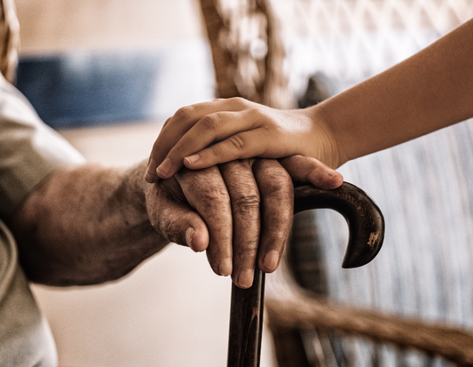 Younger Hand Placed on Older Hand