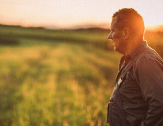 Farmer walking in field