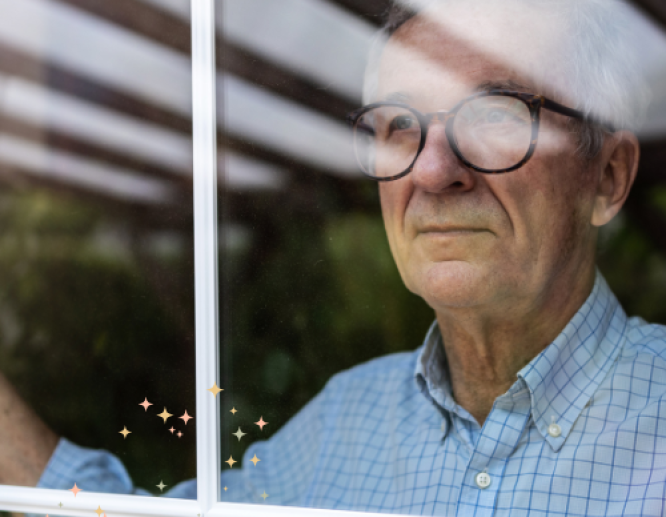 man looking out window